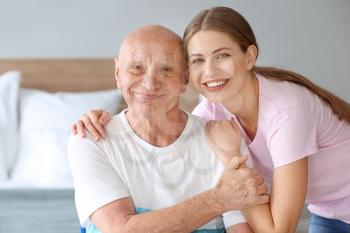 Young woman visiting her father in nursing home�