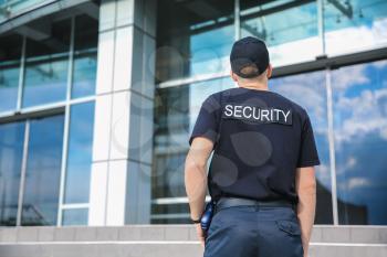 Handsome male security guard outdoors�