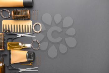 Set of hairdresser tools and accessories on dark background�