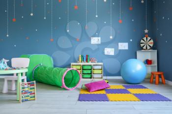 Stylish interior of modern playroom in kindergarten�