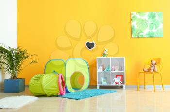 Interior of modern children's room with play tunnel�