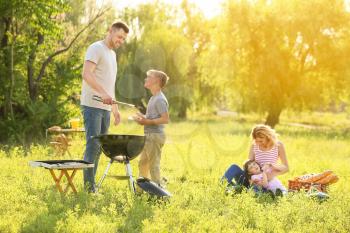 Happy family on summer picnic in park�