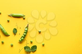Tasty fresh peas on color background�