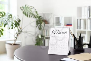 Flip paper calendar and stationery on office table�