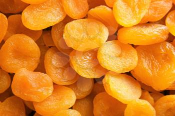 Tasty dried apricots as background�