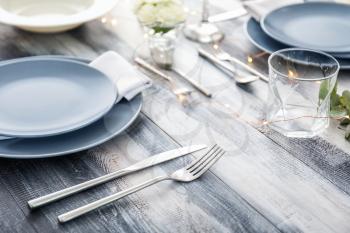 Beautiful table setting on wooden background�