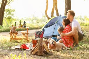 Happy family spending weekend in forest�