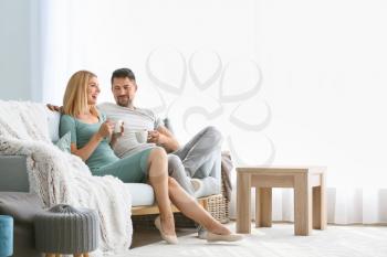 Happy couple in love resting at home�