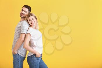 Portrait of happy couple in love on color background�