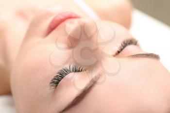 Beautiful young woman with eyelash extensions, closeup�