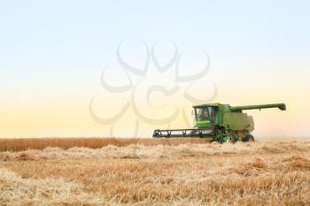 Combine harvester in wheat field�