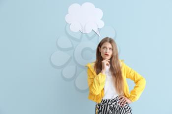 Thoughtful young woman with speech bubble on color background�