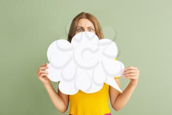 Surprised young woman with speech bubble on color background�