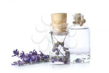 Bottles of lavender essential oil on white background�