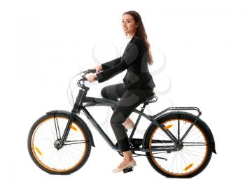 Young businesswoman riding bicycle against white background�