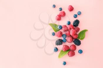Sweet ripe berries on color background�