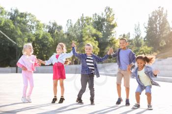 Group of jumping children outdoors�