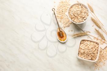 Oat flakes with honey on light table�