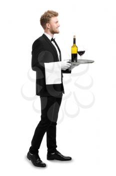 Handsome waiter with wine on white background�