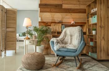 Cozy rocking chair in interior of living room 