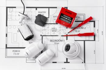 Different equipment of security system on home plan�