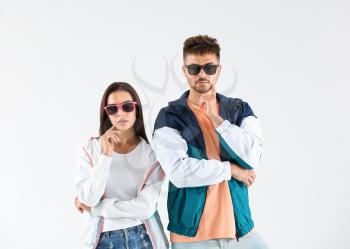 Fashionable young couple on white background�