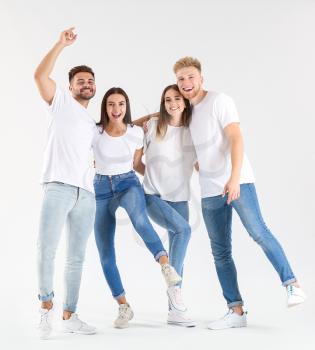 Group of young people in stylish casual clothes on white background�