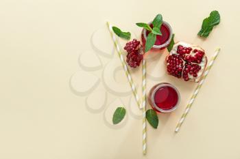 Composition with fresh pomegranate juice on light background�