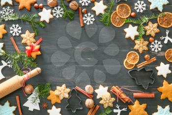 Composition with tasty Christmas cookies and place for text on dark wooden background�