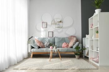 Interior of beautiful modern room with comfortable sofa�