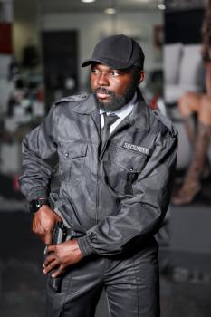 African-American security guard working in building�
