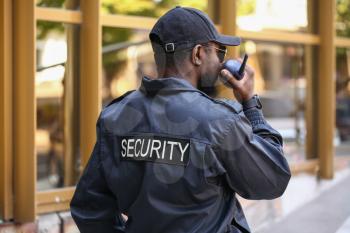African-American security guard outdoors�