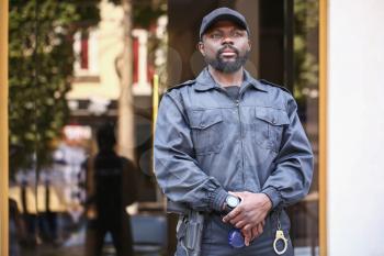 African-American security guard outdoors�