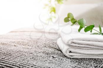 Clean soft towels on bed in room�