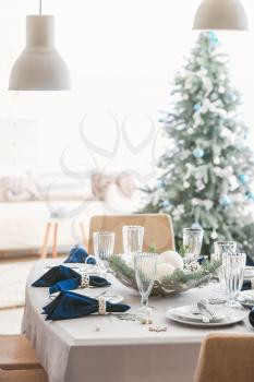 Festive table setting for Christmas dinner at home�