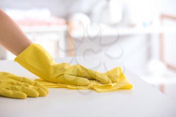 Woman cleaning table at home, closeup�