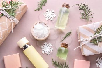 Christmas gift boxes and products for spa treatment on color background�