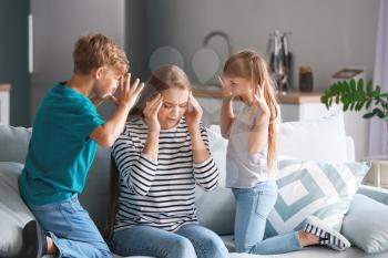 Angry children scolding their mother at home�