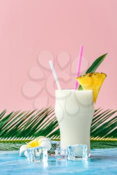 Glass of tasty Pina Colada cocktail on table�