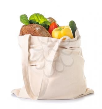 Stylish eco bag with fresh products on white background�