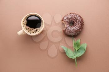 Composition with sweet tasty donut and cup of coffee on color background�
