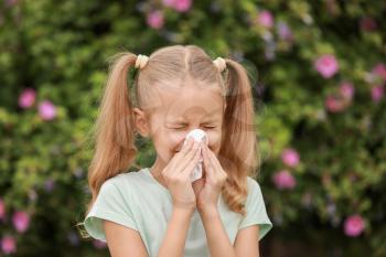 Little girl suffering from allergy outdoors�