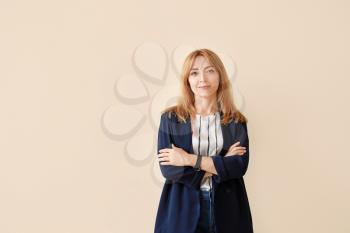 Portrait of stylish mature businesswoman on light background�