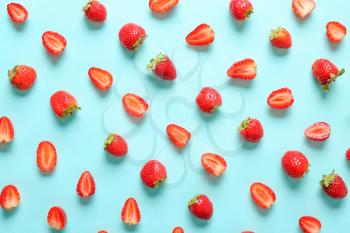 Many sweet ripe strawberry on color background�