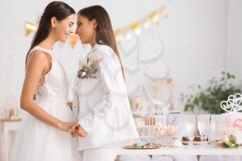 Beautiful lesbian couple during wedding ceremony�