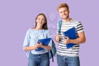 Portrait of female and male students on color background�
