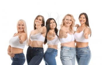 Group of body positive women showing thumb-up on white background�