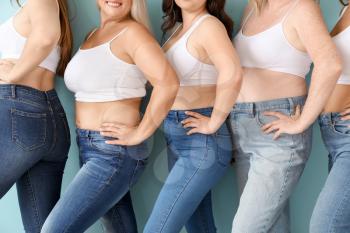 Group of body positive women on color background�