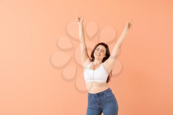 Portrait of body positive woman on color background�