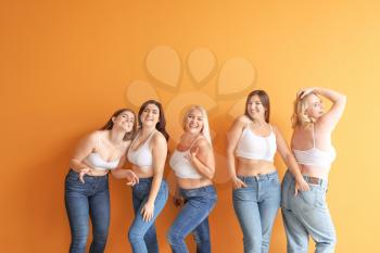 Group of body positive women on color background�